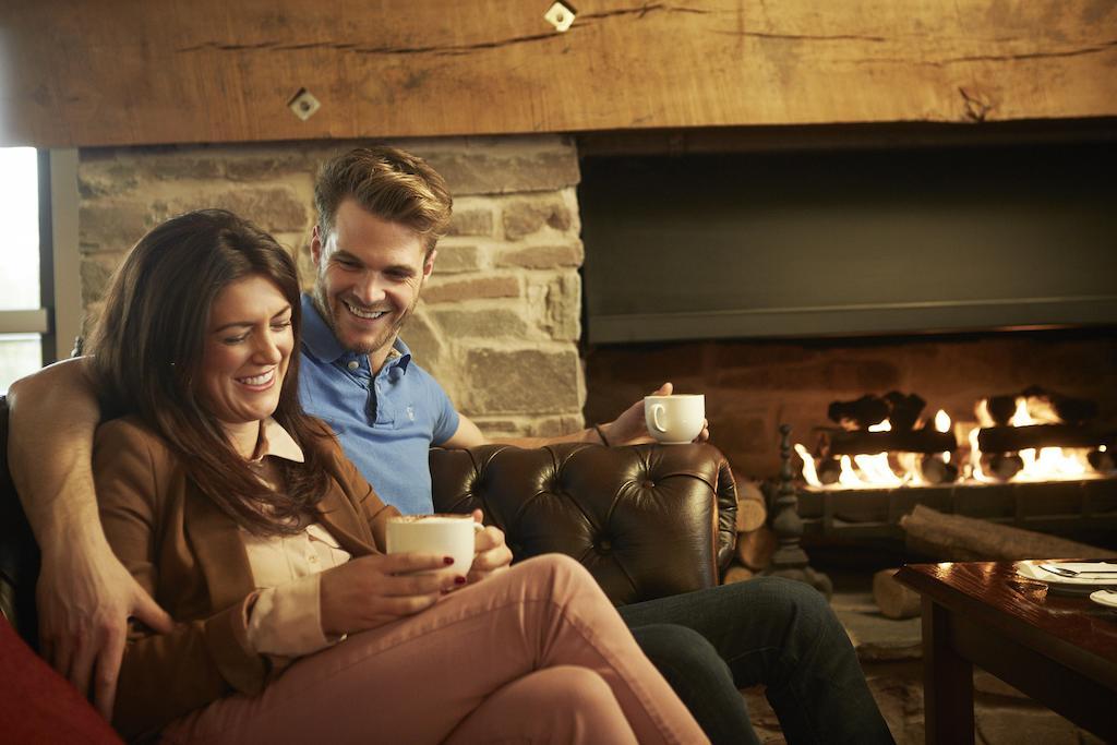 The Celtic Manor Resort Newport  Bagian luar foto A couple drinking coffee